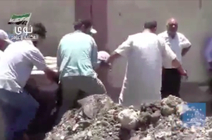Still from a video produced by Human Rights Watch showing the aftermath of a barrel bomb attack (http://multimedia.hrw.org/distribute/iyvtqzelcp)